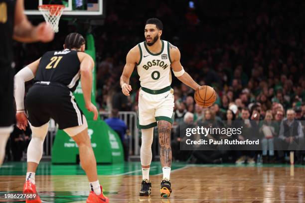 Jayson Tatum of the Boston Celtics dribbles the ball during the first half against the Memphis Grizzlies at TD Garden on February 04, 2024 in Boston,...