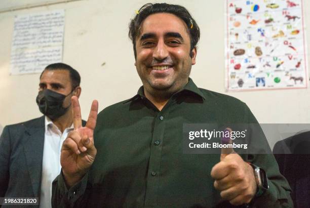 Bilawal Bhutto Zardari, chairman of Pakistan Peoples Party and former foreign minister, shows his finger marked with the indelible ink after casting...