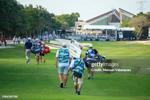Charles Howel III of Crushers GC, Captain Sergio Garcia of Fireballs GC, and Captain Brooks Koepka of Smash GC walk to the green of the 18th hole...