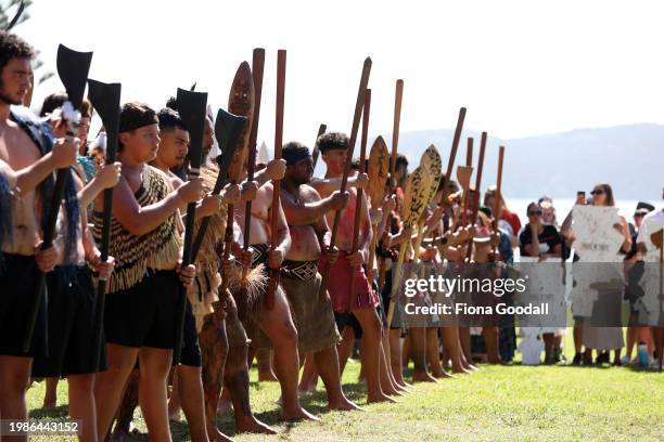 Maori warriors prepare to welcome the New Zealand government representatives including Prime Minister Christopher Luxon at Te Whare Rūnanga during a...