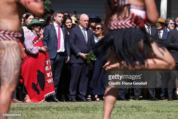 New Zealand government representatives including Prime Minister Christopher Luxon and ACT leader David Seymour are welcomed onto Te Whare Rūnanga...