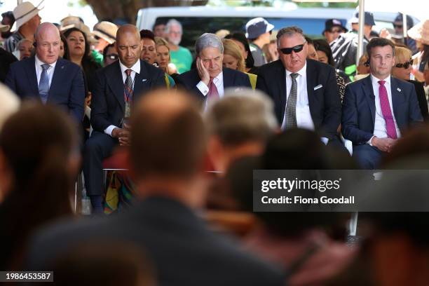 New Zealand government representatives including Prime Minister Christopher Luxon Winston Peters Shane Jones and David Seymour listen at Te Whare...