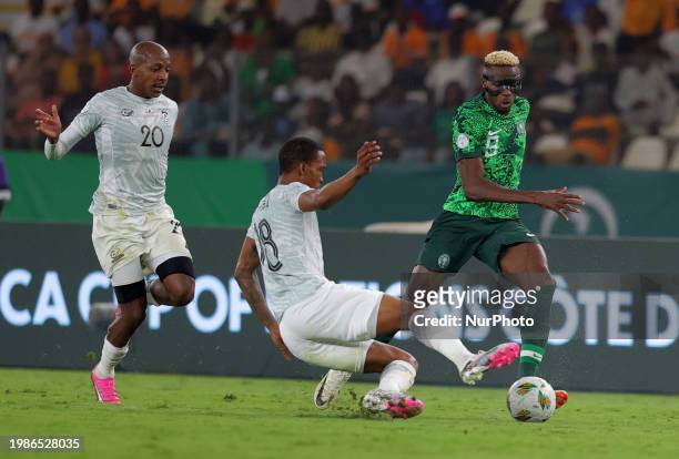 Nigerian player Victor James Osimhen is fighting for the ball with Gomolemo Grant Kekana of South Africa during the African Cup of Nations 2024...