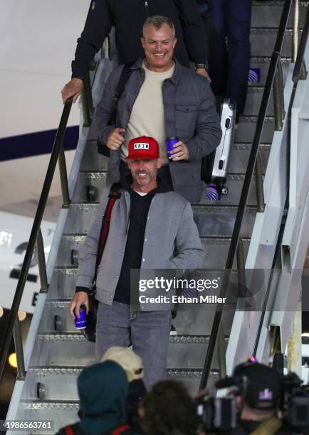 Head coach Kyle Shanahan and president of football operations and general manager John Lynch of the San Francisco 49ers deplane as they arrive for...