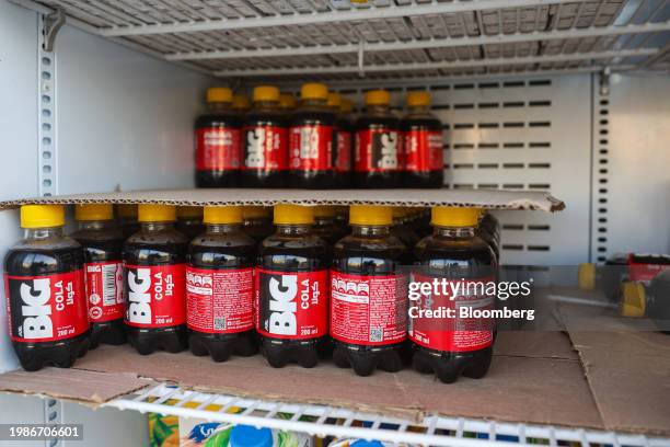 Bottles of Big Cola soda, an AGE Group brand, cooled in a refrigerator at a supermarket in Cairo, Egypt, on Tuesday, Jan. 16, 2024. Driven by a...