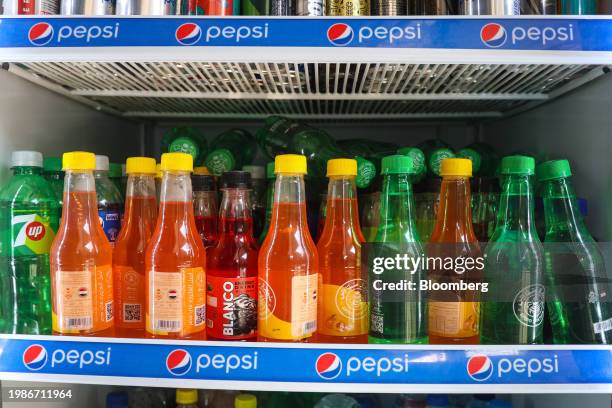 Bottles of local soda brand Spiro Spathis in a Pepsi branded refrigerator at a supermarket in Cairo, Egypt, on Tuesday, Jan. 16, 2024. Driven by a...