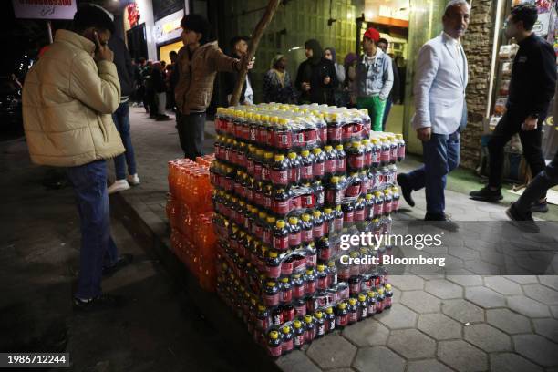 Crates of local soda brand Spiro Spathis and Big Cola, an AGE Group brand, stacked outside a supermarket in Cairo, Egypt, on Tuesday, Jan. 16, 2024....