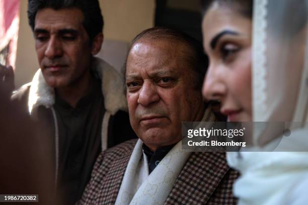 Nawaz Sharif, Pakistan's former prime minister, center, and his daughter Maryam Nawaz Sharif, right, at a polling station in Lahore, Pakistan, on...