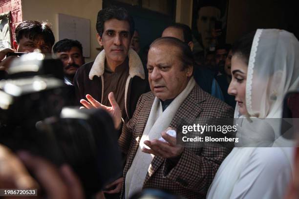 Nawaz Sharif, Pakistan's former prime minister, center, and his daughter Maryam Nawaz Sharif, right, at a polling station in Lahore, Pakistan, on...