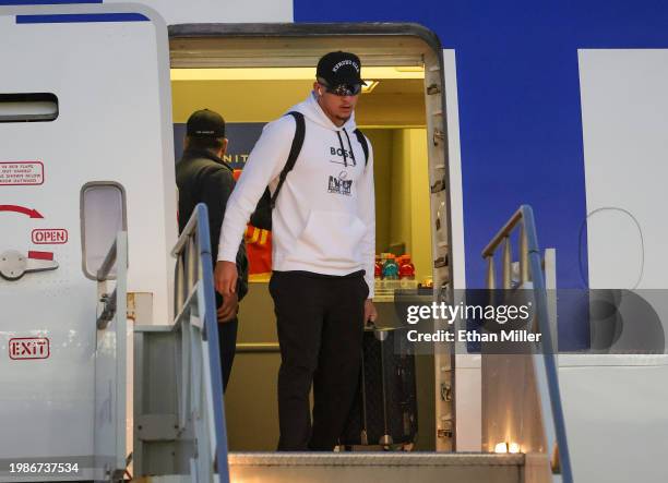 Quarterback Patrick Mahomes of the Kansas City Chiefs deplanes as he arrives for Super Bowl LVIII at Harry Reid International Airport on February 04,...