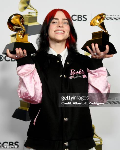 Billie Eilish, winner of the "Best Song Written for Visual Media" and "Song of the Year" awards for “What Was I Made For?", poses in the press room...