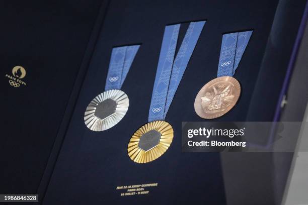 The Chaumet-designed Paris 2024 Olympic gold, silver and bronze medals, featuring a hexagon-shaped piece of iron taken from the original Eiffel...