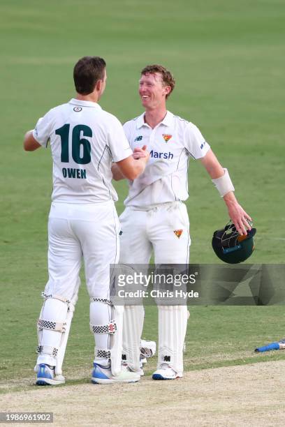 Jordan Silk and Michell Owen of Tasmania celebrate winning the Sheffield Shield match between Queensland and Tasmania at The Gabba, on February 05 in...