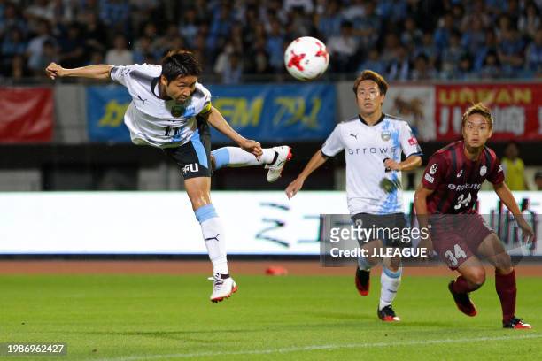 Yu Kobayashi of Kawasaki Frontale heads to score the team's third goal during the J.League J1 match between Kawasaki Frontale and Vissel Kobe at...