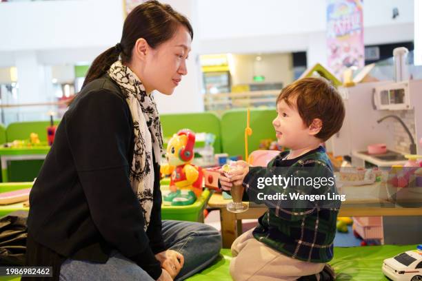 mother accompanying her child - accompanying stock pictures, royalty-free photos & images