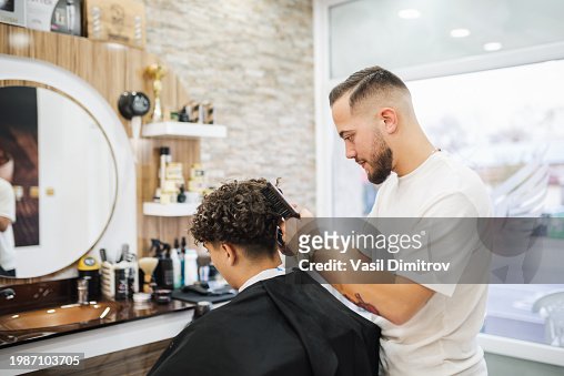 Barber Giving A Haircut In His Shop High-Res Stock Photo - Getty Images