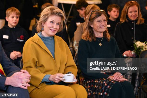 Queen Mathilde of Belgium holds a hot frink during a royal visit to the Mik'Ados project of organisation AniMagique, in Villers-la-Ville on February...