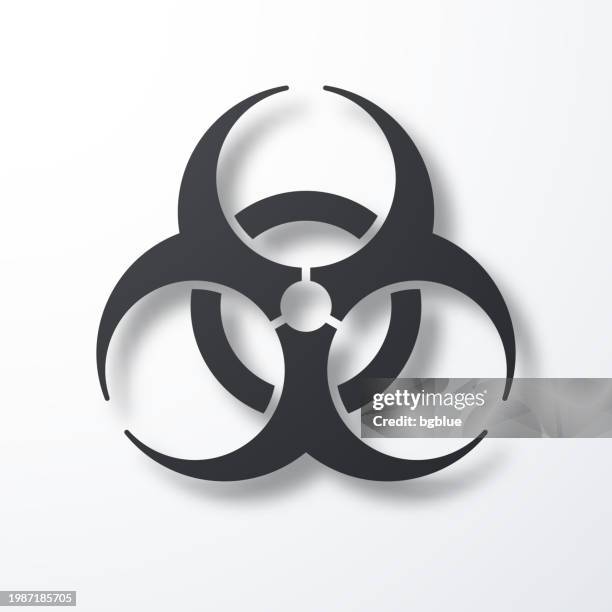 biological hazard symbol. icon with shadow on white background - biohazard stock illustrations