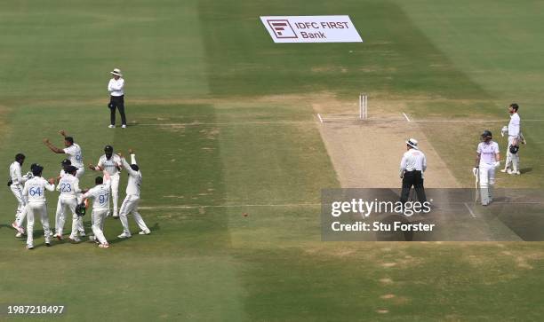 India fielder Shreyas Iyer and team mates celebrate as the review decision is given after running out England captain Ben Stokes with a direct throw...