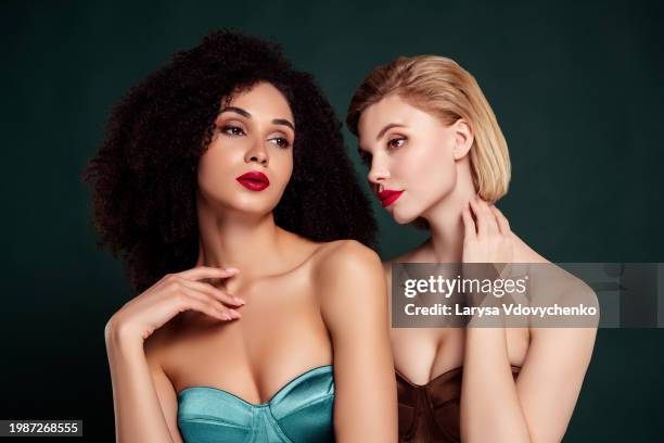 photo of attractive girlfriends in cocktail stylish top gowns touch flirt isolated dark green color background - black corset stock pictures, royalty-free photos & images