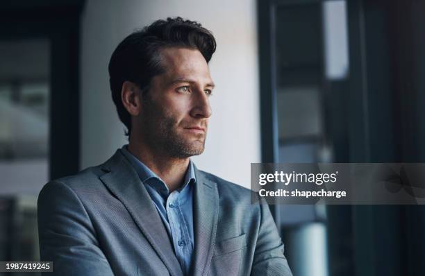 thinking, brainstorming and businessman in office by window planning for legal company project. ideas, vision and professional male attorney with problem solving expression for law case in workplace. - lawyers serious stock pictures, royalty-free photos & images