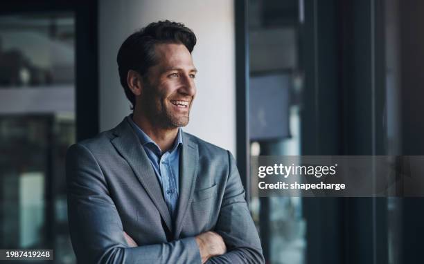 smile, vision and arms crossed with business man in suit at corporate office, thinking of company growth. future, idea or planning with confident mature employee in professional workplace for career - cheerful businessman stock pictures, royalty-free photos & images