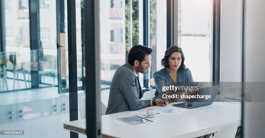 Business man, woman and laptop in discussion in team, brainstorming or proposal for b2b collaboration. People, computer or meeting with paperwork for financial strategy, idea or negotiation in office
