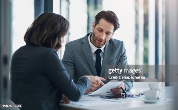 business man, woman and documents in negotiation for deal, agreement and proposal for b2b collaboration. people, staff and meeting with paperwork for financial strategy, stats and feedback in office - office sitting stock pictures, royalty-free photos & images