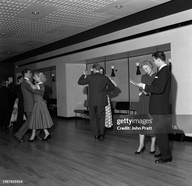 Dancing couples during a lesson at the Arthur Murray School of Dancing in Leicester Square, London, November 1955.