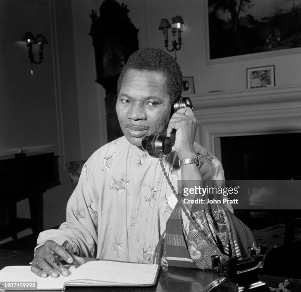 Chief Michael Okorodudu, West Nigeria's representative in London, working in his office at home in Grosvenor Gardens, Westminster, November 1955.