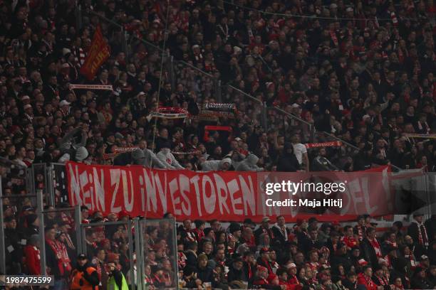 Fans of 1. FC Union Berlin with banner that reads "No to the investors in DFL" during the Bundesliga match between RB Leipzig and 1. FC Union Berlin...