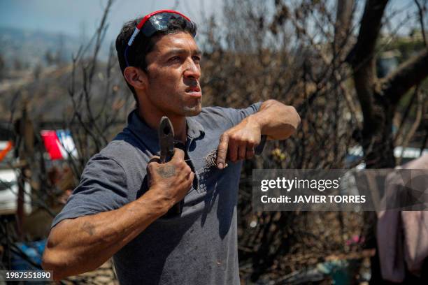 Humberto Guerra is pictured at the site of his house burned by forest fires in the Poblacion Monte Sinai neighborhood in Viña Del Mar, Chile, on...