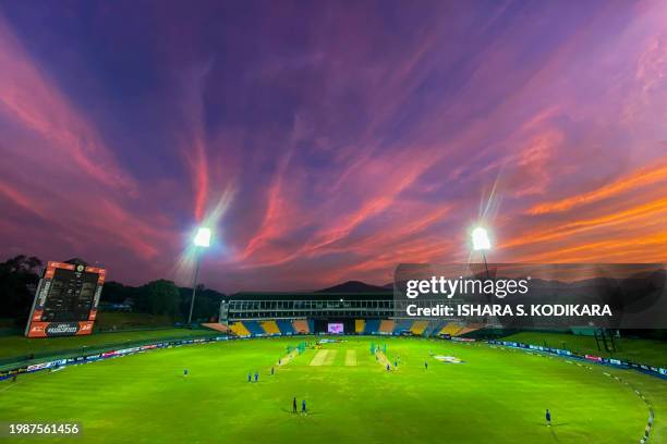 This picture shows a general view at sunset as Afghanistan's players attend a practice session at the Pallekele International Cricket Stadium in...