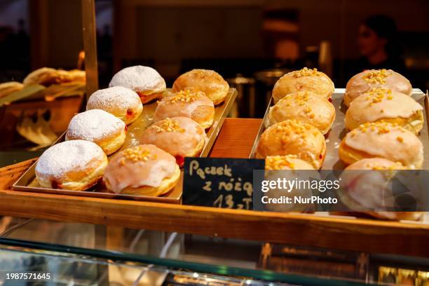 Fresh doughnuts are seen in a shop on Fat Thursday , February 8, 2024 in central Krakow, Poland. Fat Thursday is a Polish tradition, with its roots...