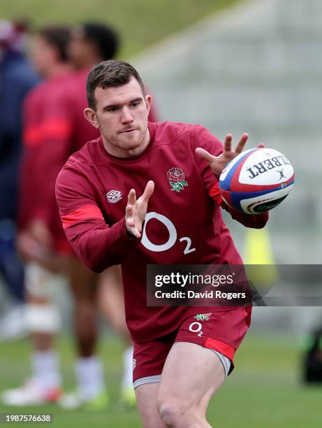 Ben Spencer of England receives a pass during the England Rugby Training session at Pennyhill Park on February 05, 2024 in Bagshot, England.