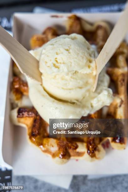 close-up of waffle with ice-cream on top - dessert topping stock pictures, royalty-free photos & images