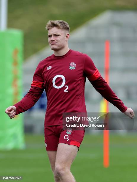 Fin Smith of England looks on during the England Rugby Training session at Pennyhill Park on February 05, 2024 in Bagshot, England.