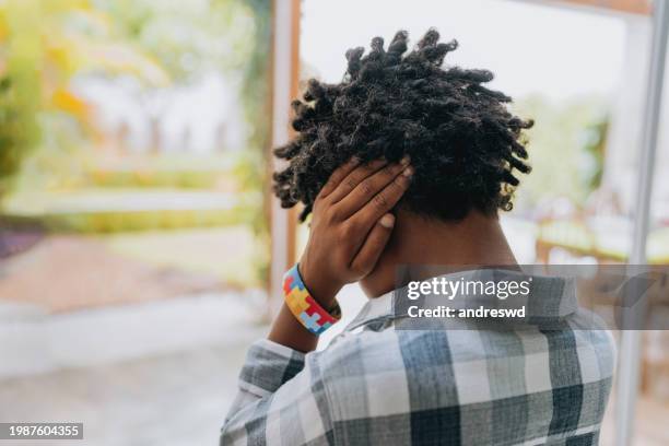 autistic child afraid of noise - autism spectrum stock pictures, royalty-free photos & images