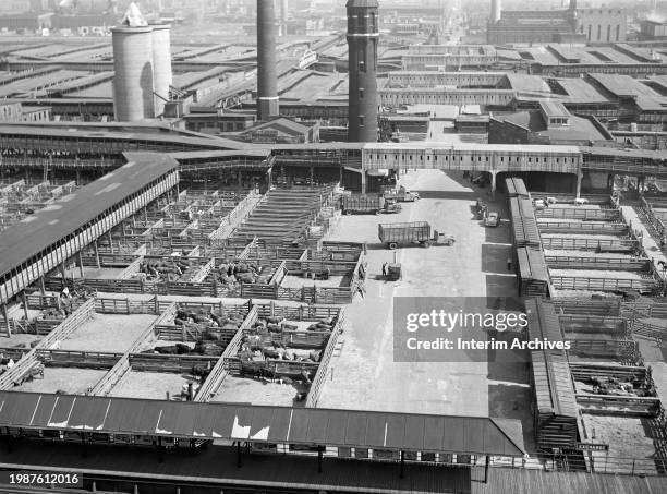 Aerial view showing the open pens and buildings of the Union Stockyards in Chicago, Illinois, July 1941. The main entrance was located at the corner...