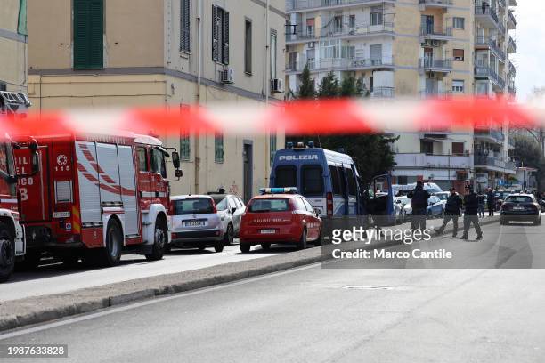 Police on the site where a man, in his apartment, first killed his wife, then shot from the window at the police, and then committed suicide, in the...