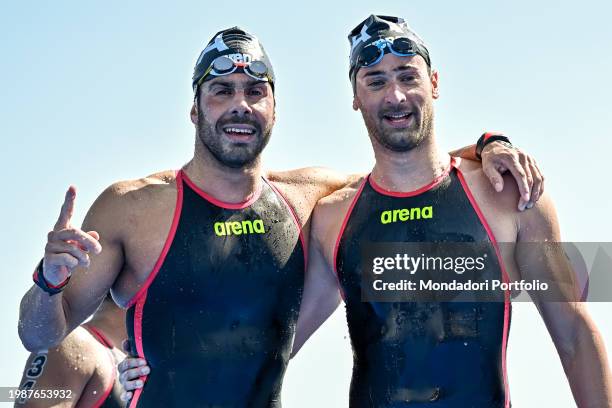 Dario Verani and Domenico Acerenza of Italy react after competing in the open water 10km Men Final during the 21st World Aquatics Championships at...