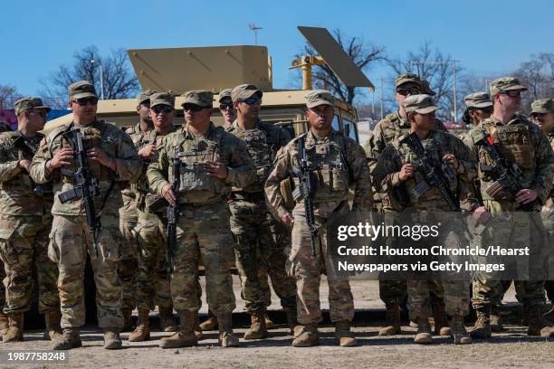 National Guard stand for Texas Gov. Greg Abbott and fellow Governors as they hold a press conference along the Rio Grande at the U.S.-Mexico border...