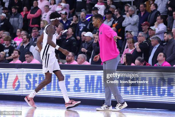 Providence Friars head coach Kim English speaks wit Providence Friars guard Davonte Gaines during a college basketball game between Creighton...