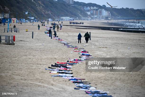 Clothing representing the 11,500 Palestinian children and 36 Israeli children killed in Gaza are seen on the beach, on February 05, 2024 in...