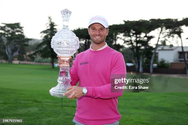 Wyndham Clark of the United States poses with the trophy after winning the AT&T Pebble Beach Pro-Am at Pebble Beach Golf Links on February 05, 2024...