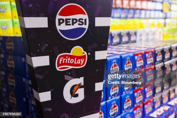 Sign displaying Pepsi, Frito-Lay and Gatorade logos as part of a Super Bowl promotion at a supermarket in Latham, New York, US, on Friday, Feb. 2,...