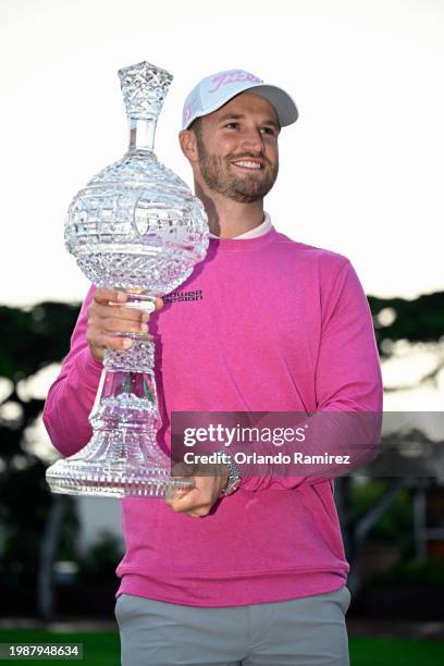 Wyndham Clark of the United States poses with the trophy after winning the AT&T Pebble Beach Pro-Am at Pebble Beach Golf Links on February 05, 2024...