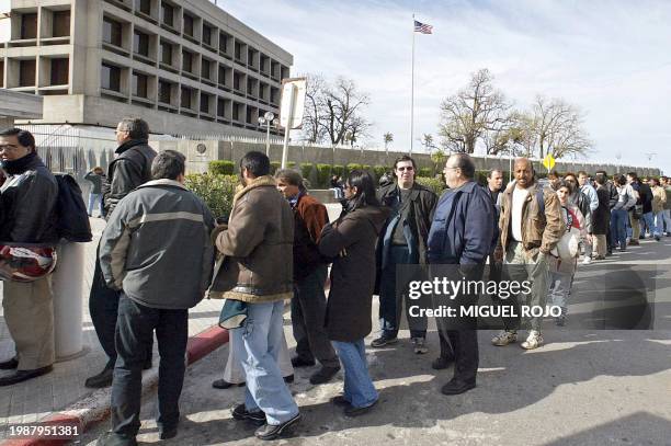 Uruguayans who are of Italian descendent wait outside the Italian consulate 16 September in an effort to apply for a passport. Due to the economic...