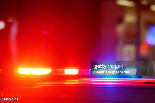 accident or crime scene concept - flashing police lights - police usa imagens e fotografias de stock