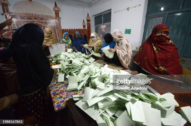 Pakistani election officials begin counting of votes after the closing of voting at a polling station in Peshawar, Pakistan, on February 08, 2024....